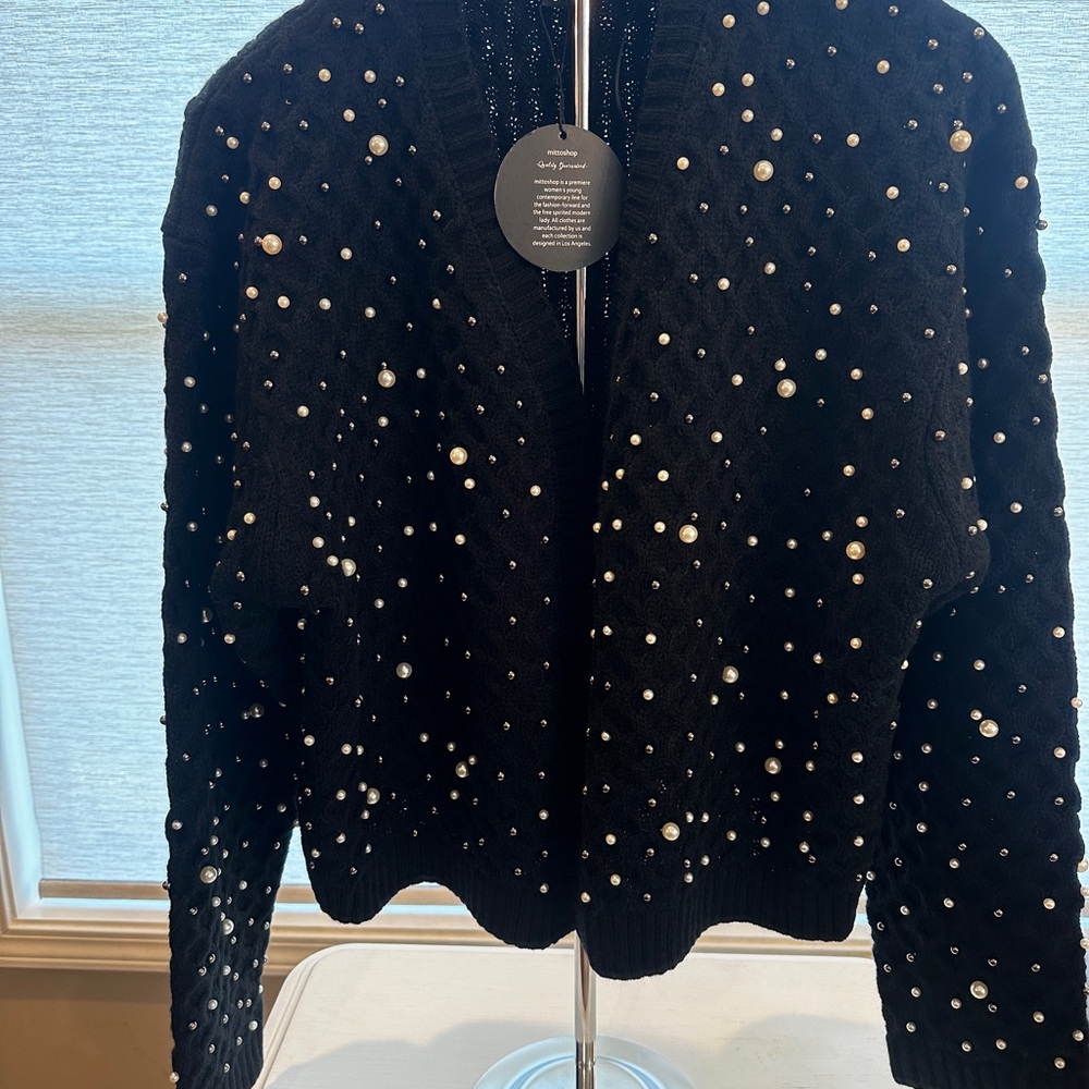 Black sweater with pearl and black beads.